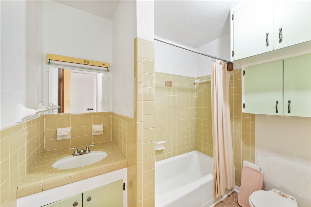 12844 Hearn Road Corpus Christi, TX 78410 - Photo 29 of 34 a bathroom with a granite countertop sink toilet and shower