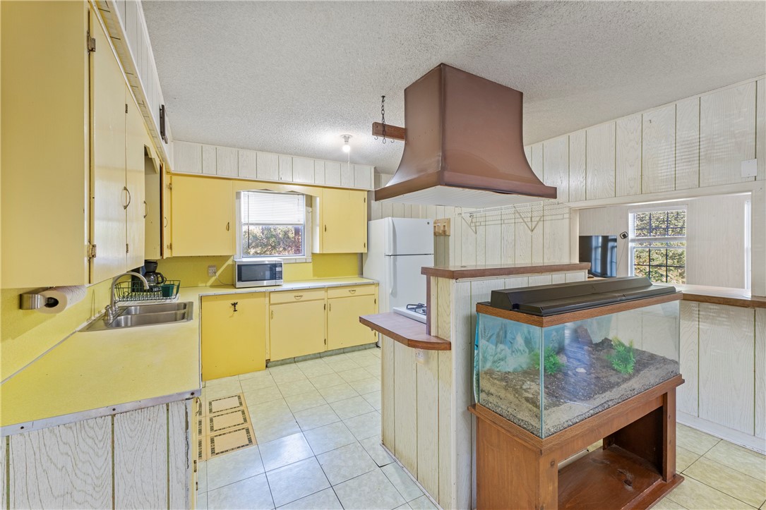 12844 Hearn Road Corpus Christi, TX 78410 - Photo 6 of 34 a kitchen with stainless steel appliances granite countertop a sink stove and refrigerator