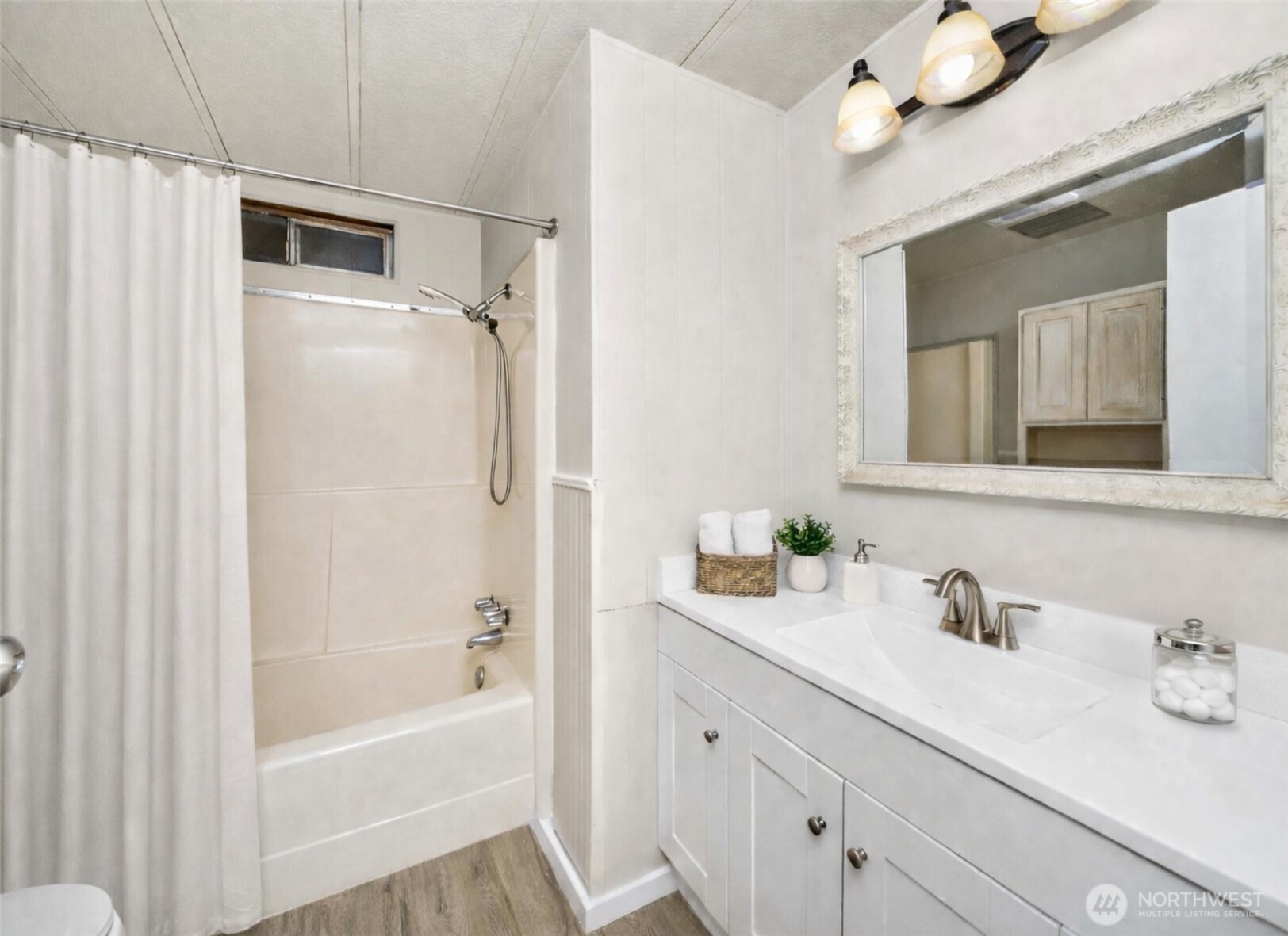 733 Tipsoo Loop South Rainier, WA 98576 - Photo 23 of 37 a bathroom with a granite countertop sink mirror and a bathtub