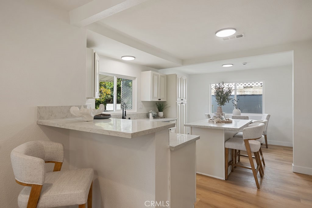 5139 San Rafael Avenue Los Angeles, CA 90042 - Photo 11 of 60 a kitchen with a sink cabinets and wooden floor