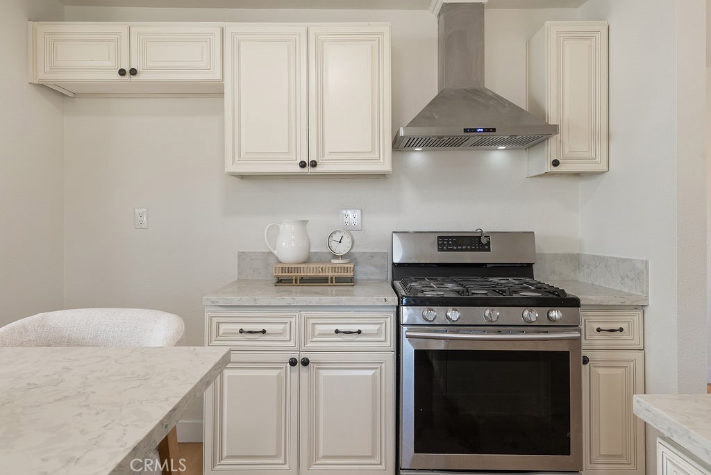 5139 San Rafael Avenue Los Angeles, CA 90042 - Photo 16 of 60 a white stove top oven sitting inside of a kitchen