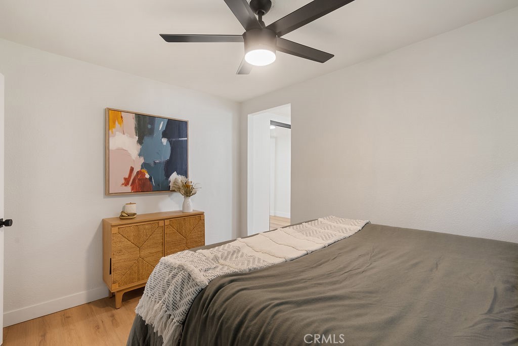 5139 San Rafael Avenue Los Angeles, CA 90042 - Photo 25 of 60 a bedroom with a bed and a painting on the wall
