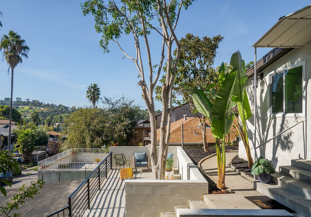 5139 San Rafael Avenue Los Angeles, CA 90042 - Photo 4 of 60 a view of balcony with a potted plant and sign