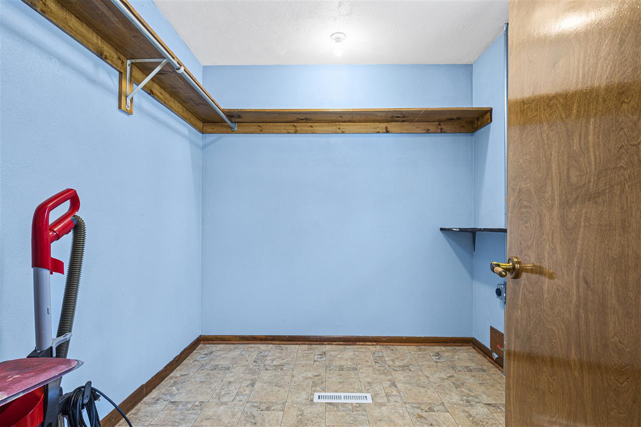 4064 Valerie Road Roscoe, IL 61073 - Photo 9 of 38 a view of a room with rack and wooden floor