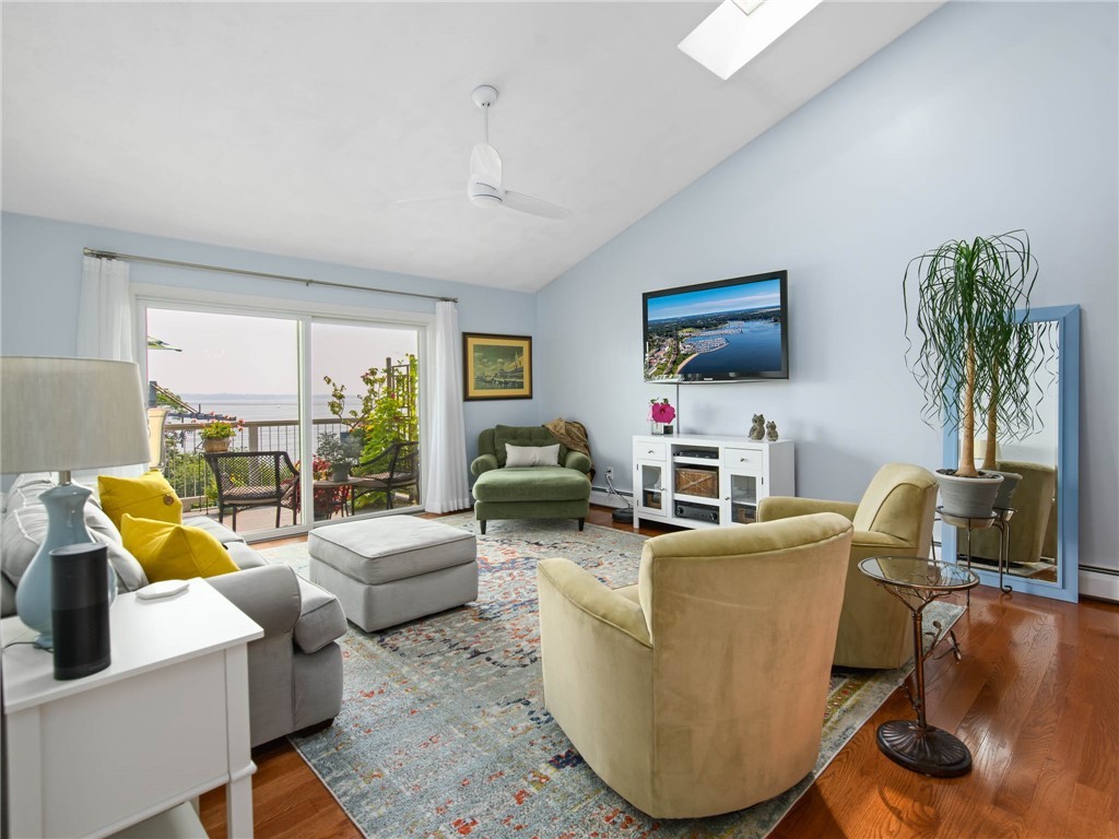 4042 Post Road, Unit 7 Warwick, RI 02886 - Photo 6 of 31 Skylights and full sliding glass doors leading to the deck