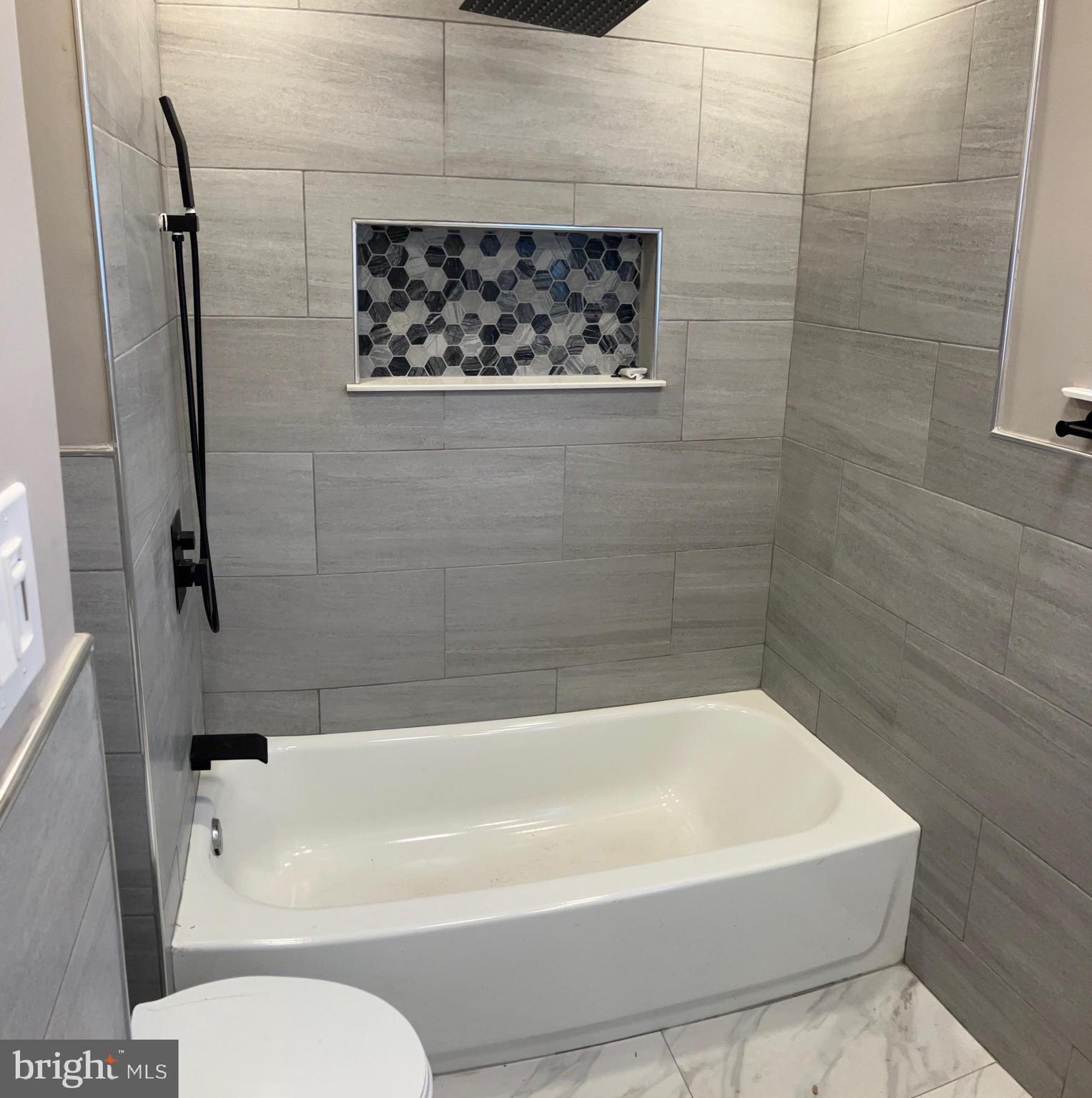 2625 Manton Street Philadelphia, PA 19146 - Photo 11 of 25 a bathroom with a shower and a bathtub