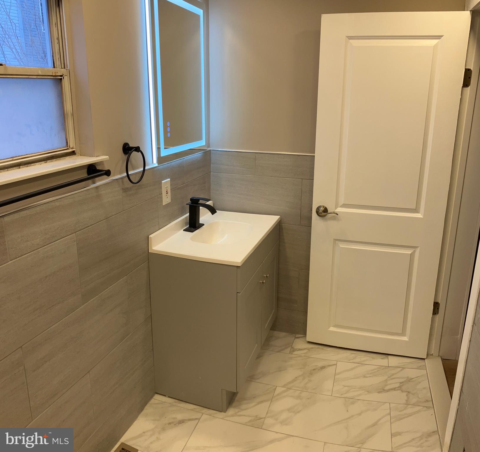 2625 Manton Street Philadelphia, PA 19146 - Photo 12 of 25 a bathroom with a sink and a mirror