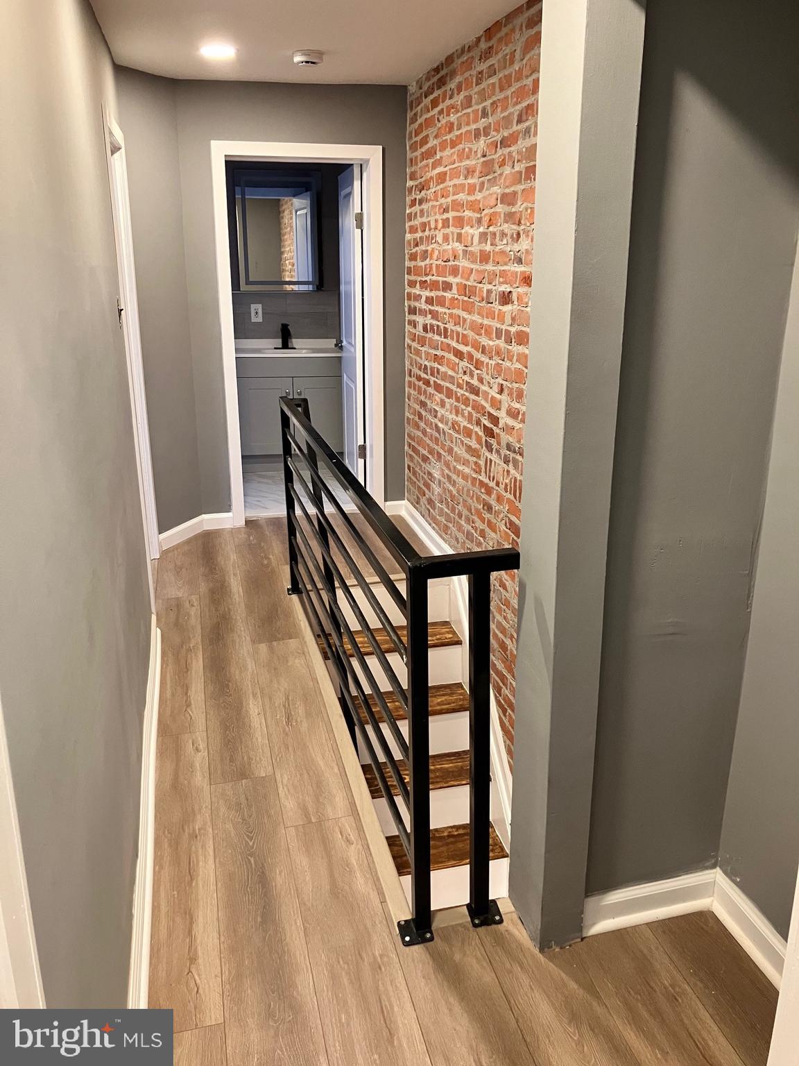 2625 Manton Street Philadelphia, PA 19146 - Photo 16 of 25 a view of a hallway with wooden floor and staircase