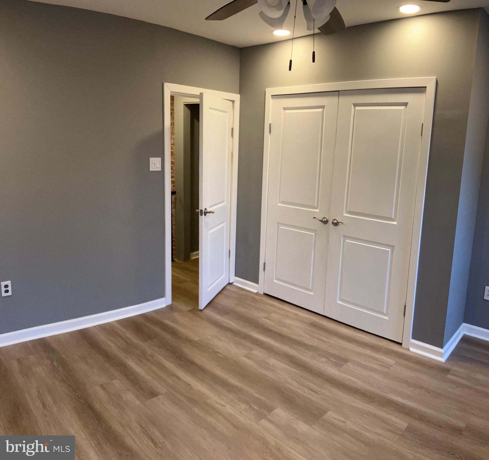 2625 Manton Street Philadelphia, PA 19146 - Photo 18 of 25 a view of an empty room with wooden floor and a window