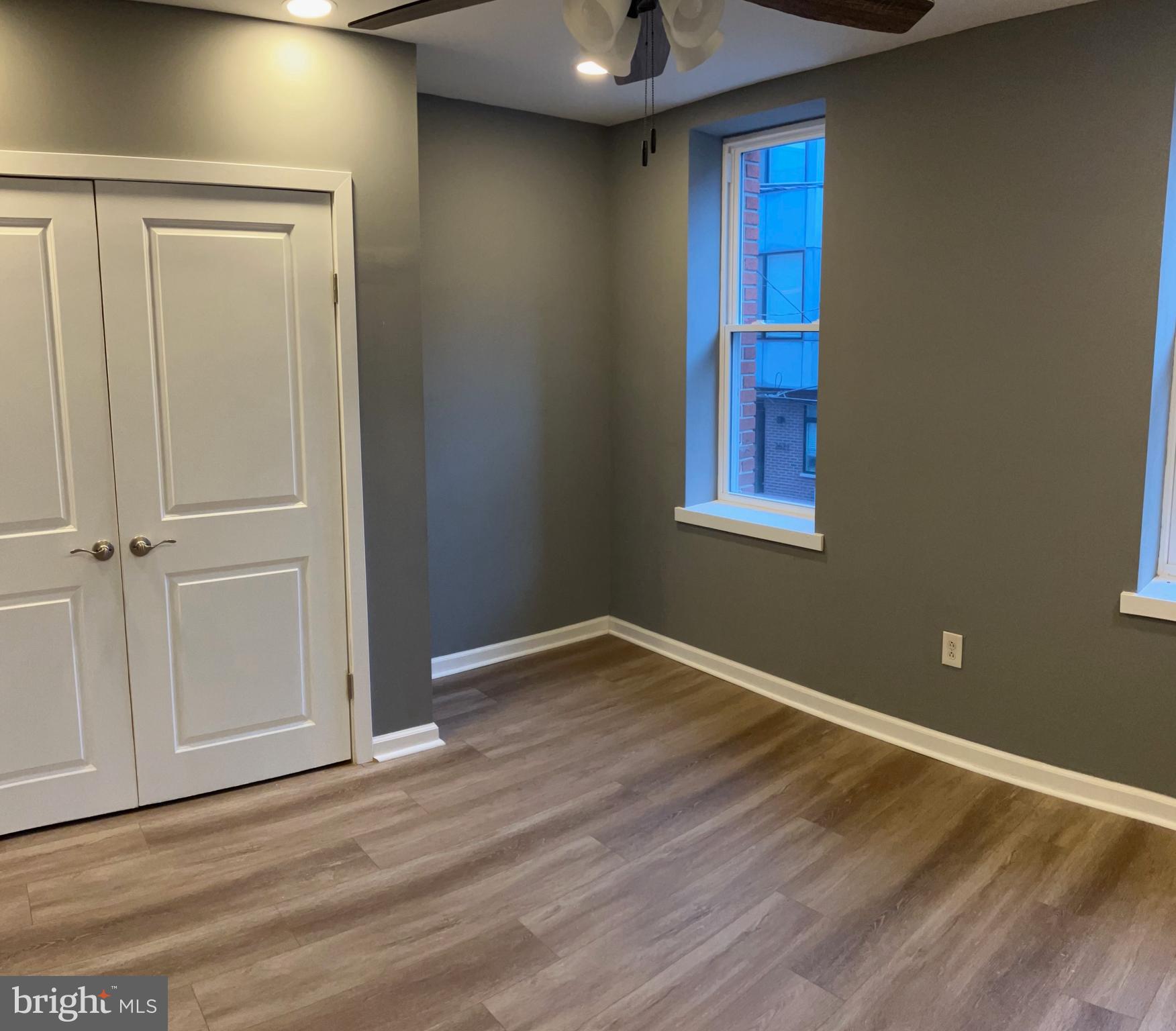 2625 Manton Street Philadelphia, PA 19146 - Photo 21 of 25 a view of an empty room with wooden floor and a window