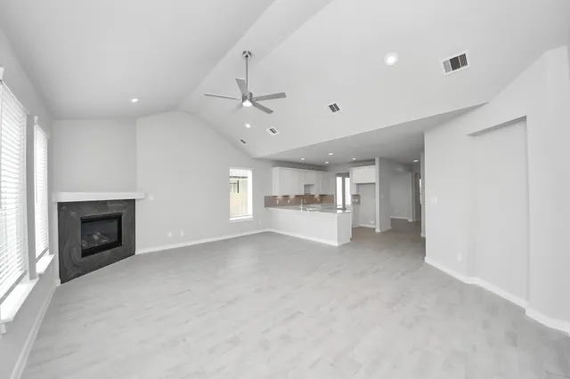 a view of an empty room with a window