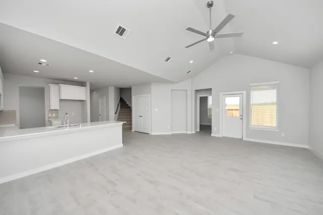 an empty room that has a window in it