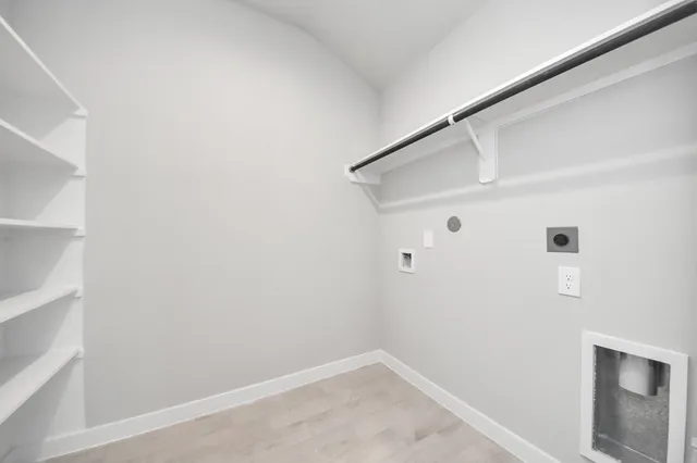 a view of a backyard with wooden fence