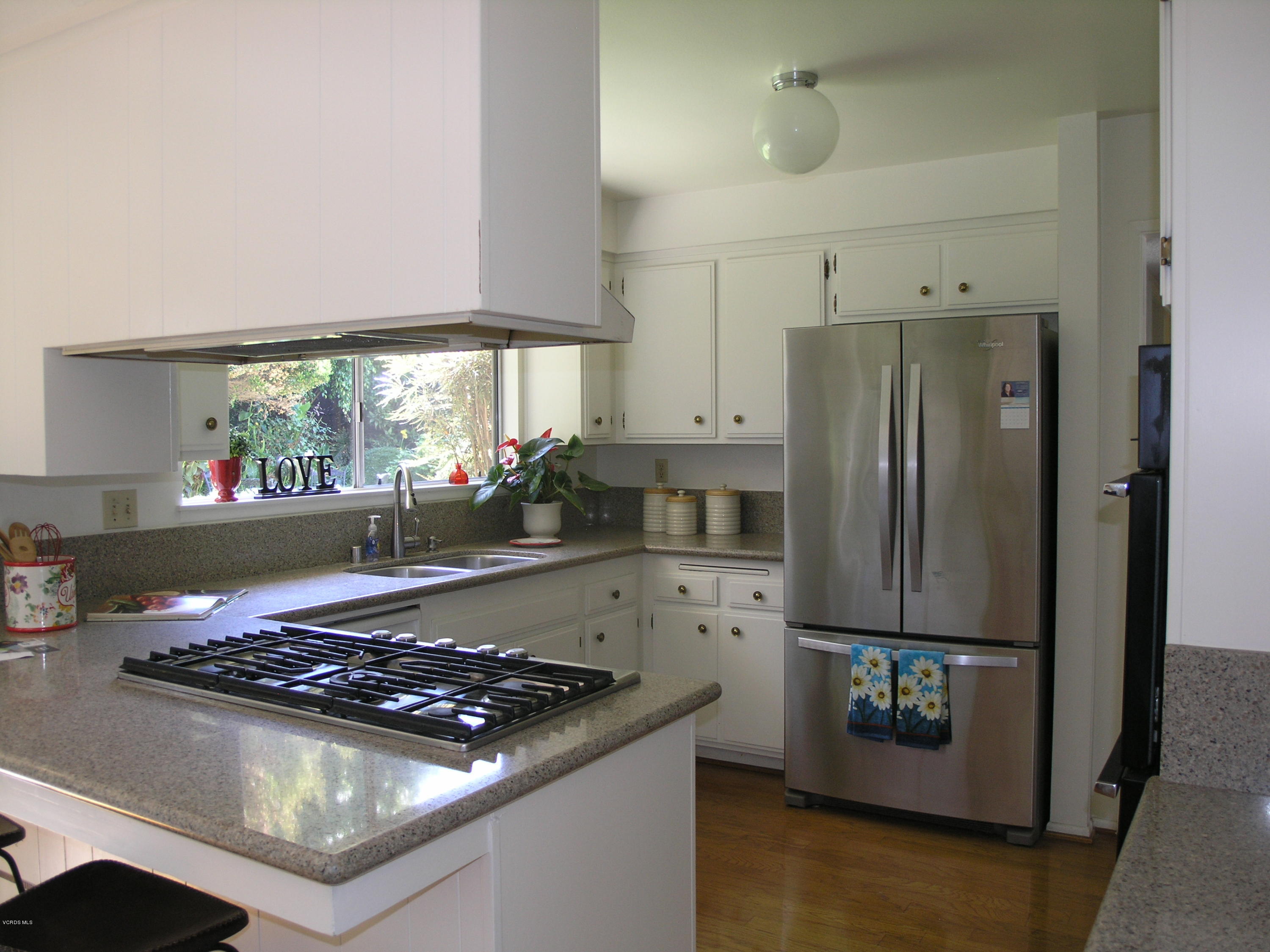 398 Day Road Ventura, CA 93003 - Photo 2 of 28 a kitchen with a stove and a refrigerator