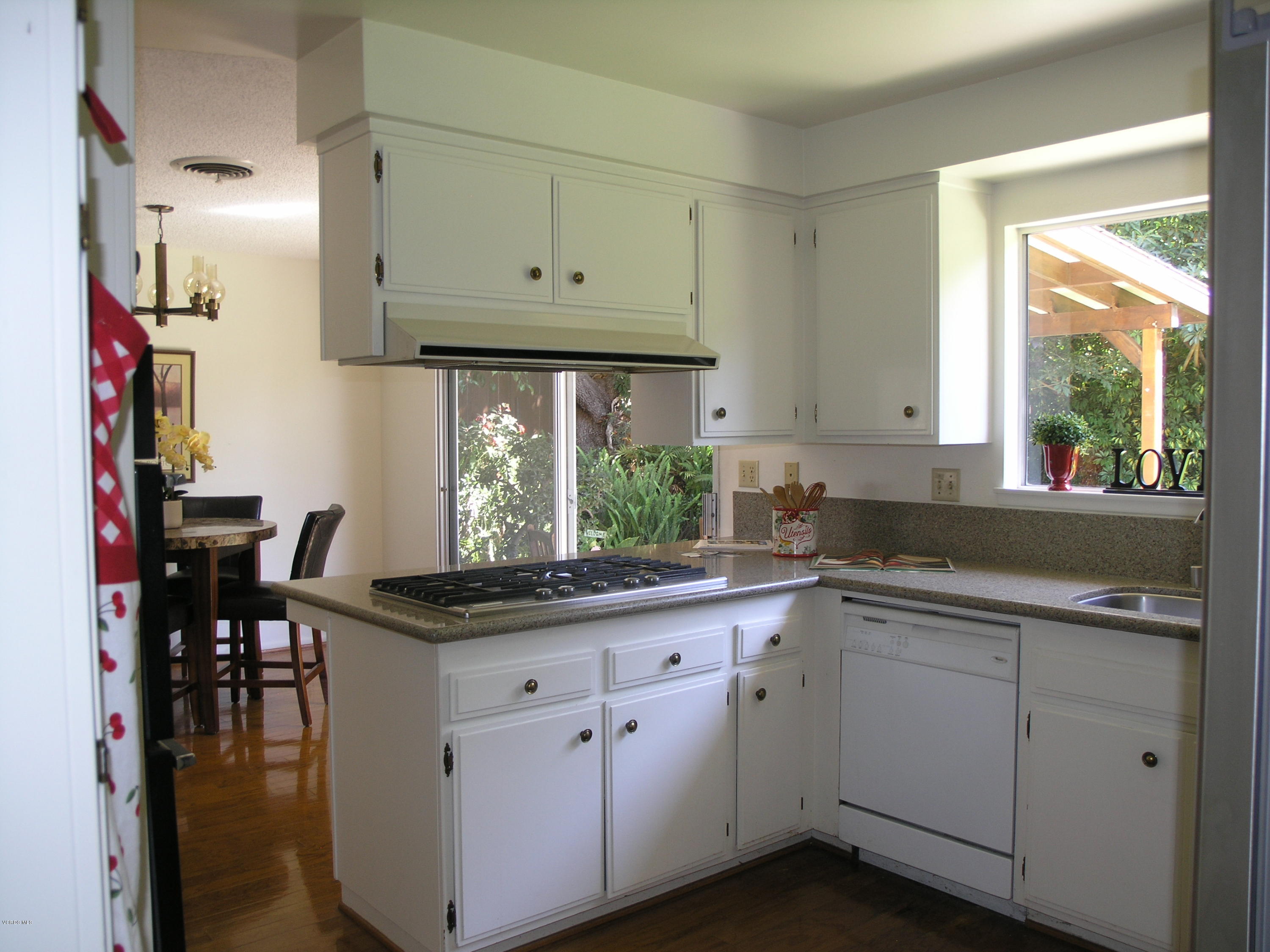 398 Day Road Ventura, CA 93003 - Photo 12 of 28 a kitchen with white cabinets and a window