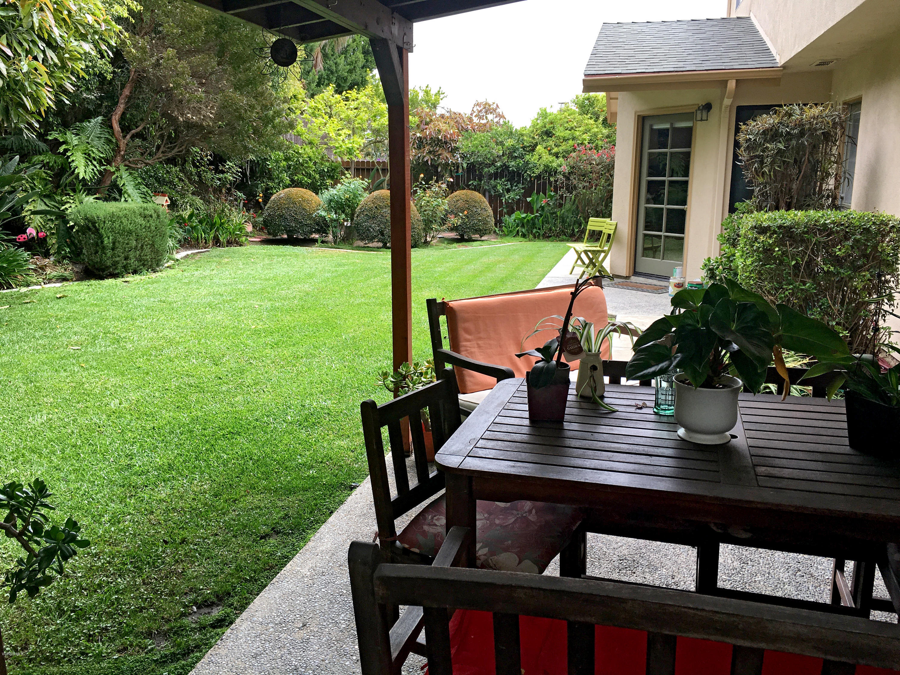 398 Day Road Ventura, CA 93003 - Photo 19 of 28 a view of a patio with table and chairs potted plants with wooden floor
