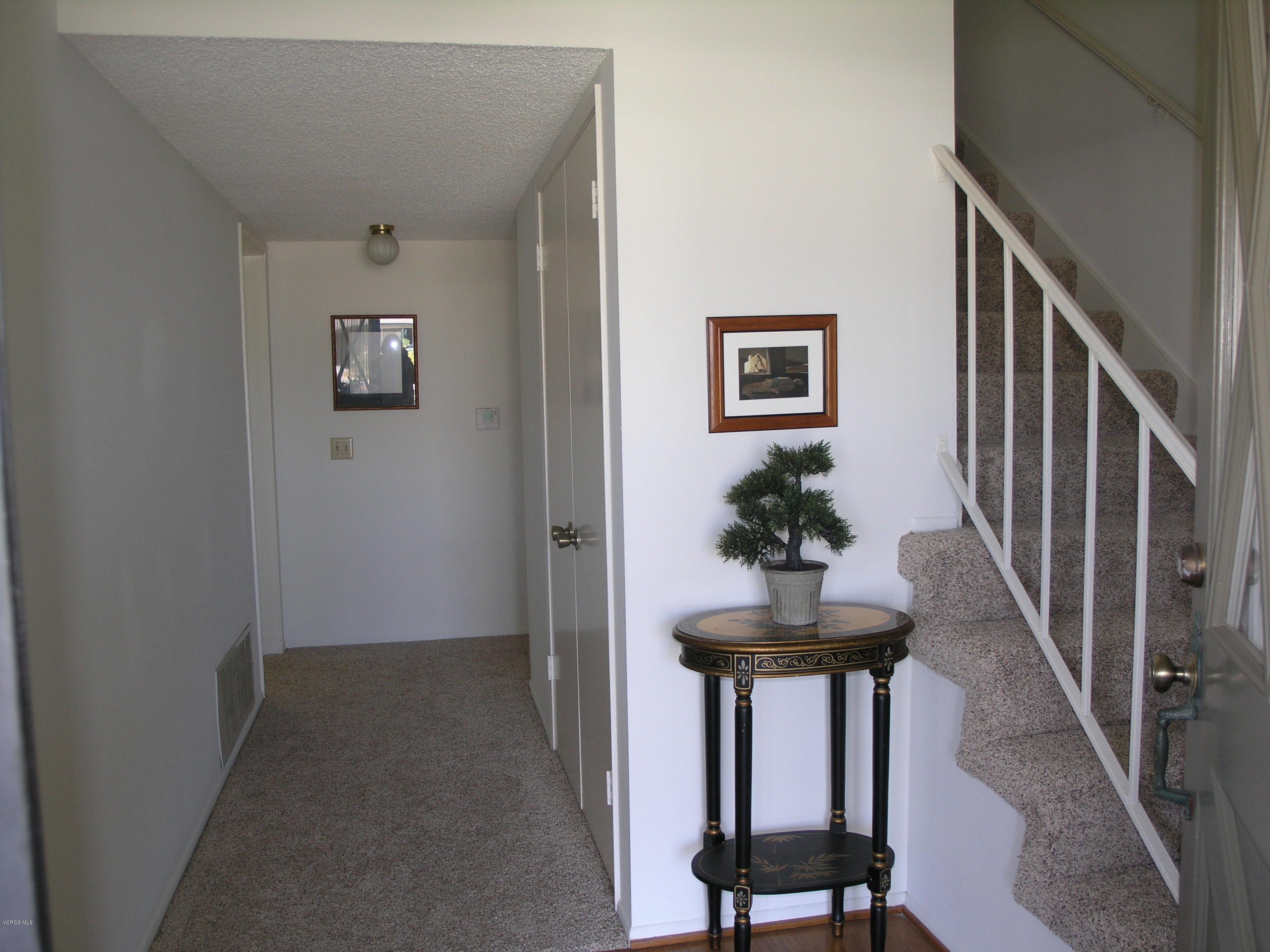 398 Day Road Ventura, CA 93003 - Photo 5 of 28 a view of a hallway with a table and a potted plant
