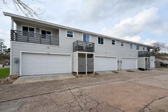 a front view of a house with a garage