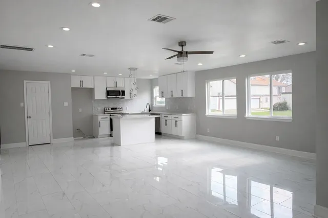 a view of kitchen with window and stainless steel appliances
