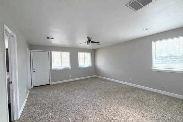a view of an empty room with a window