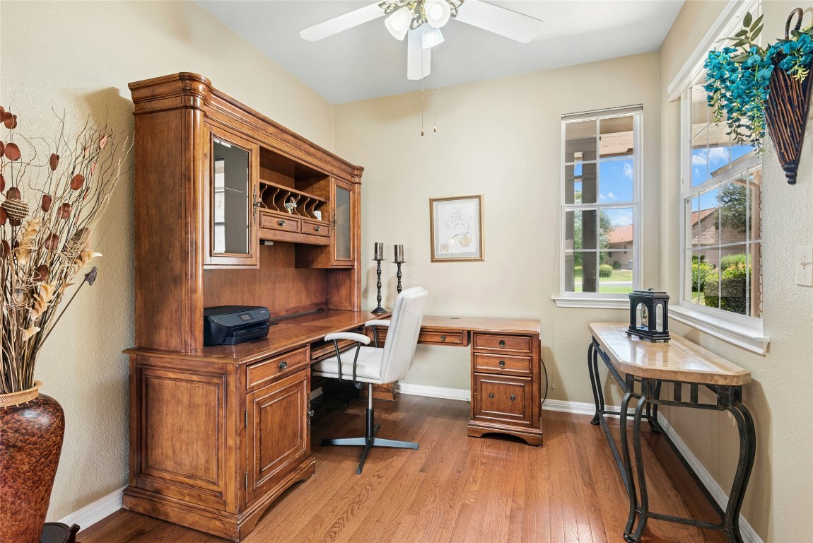 113 Coreopsis Way Georgetown, TX 78633 - Photo 12 of 34 a view of a workspace with furniture and a window