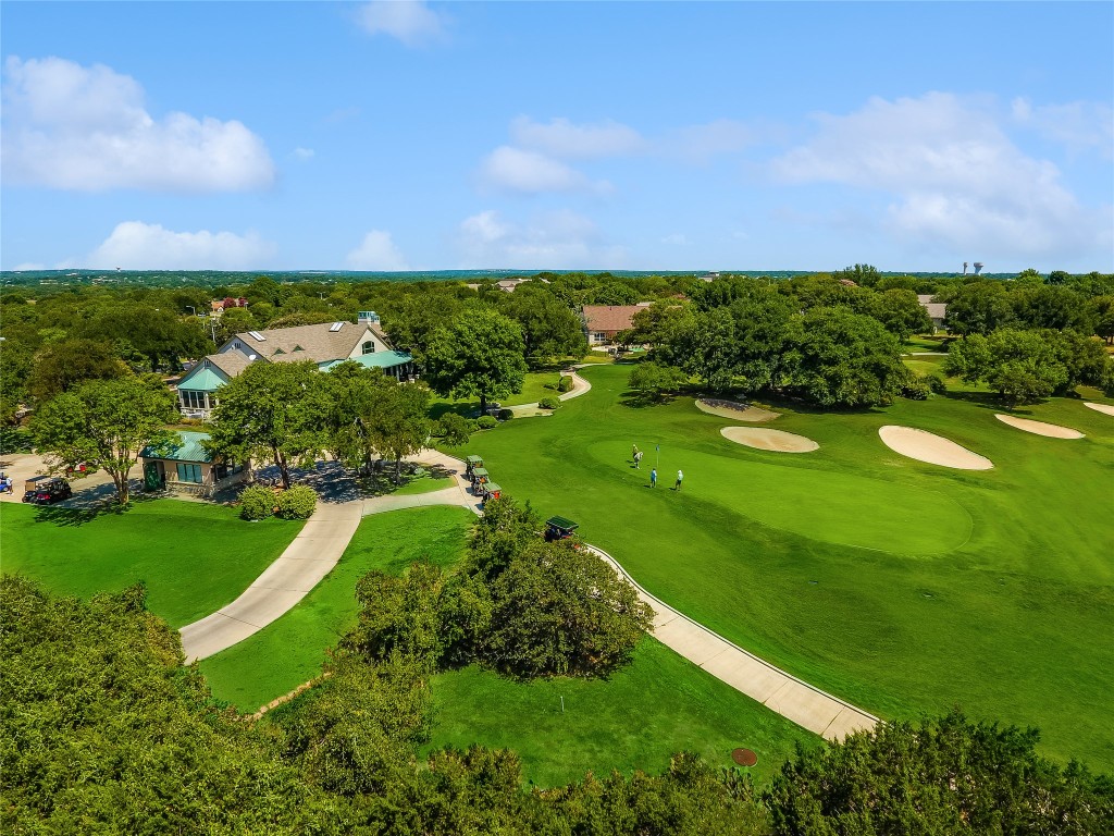 113 Coreopsis Way Georgetown, TX 78633 - Photo 32 of 34 a view of a lake with a houses