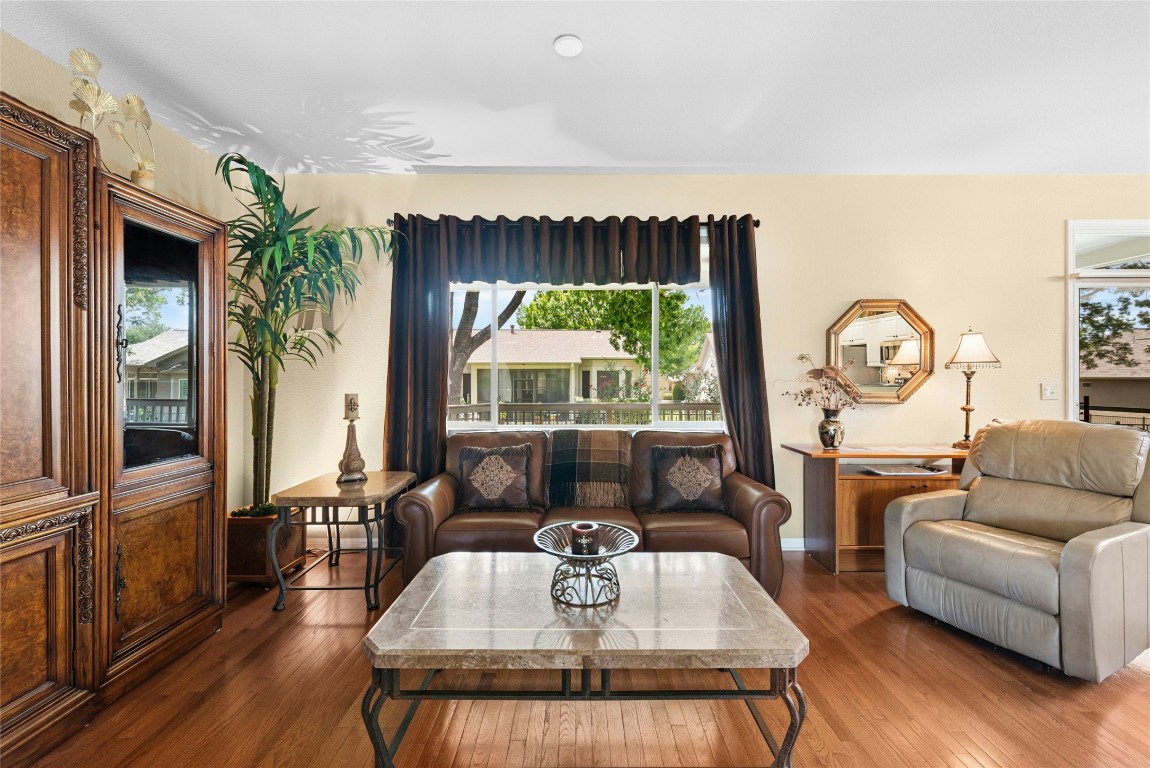 113 Coreopsis Way Georgetown, TX 78633 - Photo 4 of 34 a living room with furniture fireplace and a large window