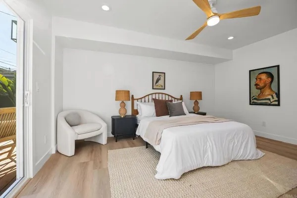 a bed room with a bed and a painting