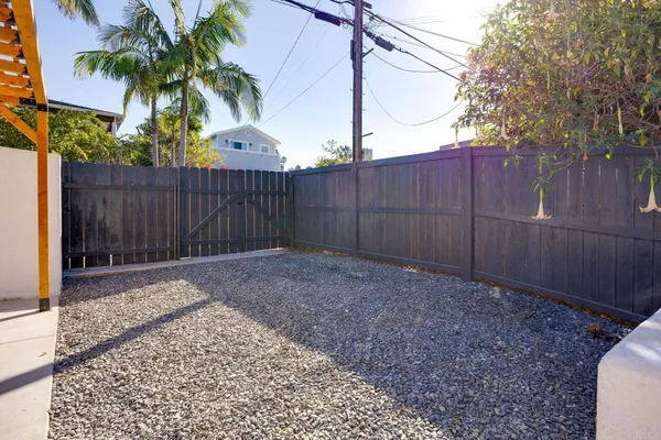 a view of a backyard with sitting area