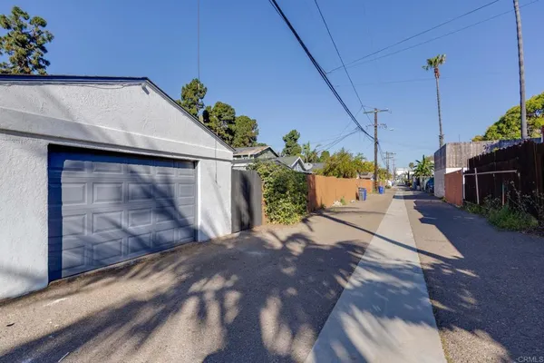 a view of a dinning table and chairs in patio of the house