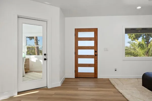 a view of front door and bedroom