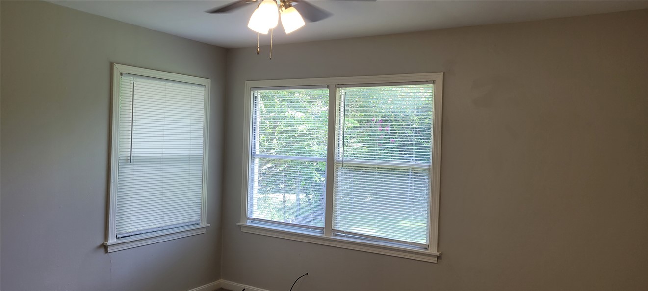 415 Sulphur Springs Road Bryan, TX 77801 - Photo 8 of 9 2nd Bedroom has carpet also. Bedroom has a view of the backyard.