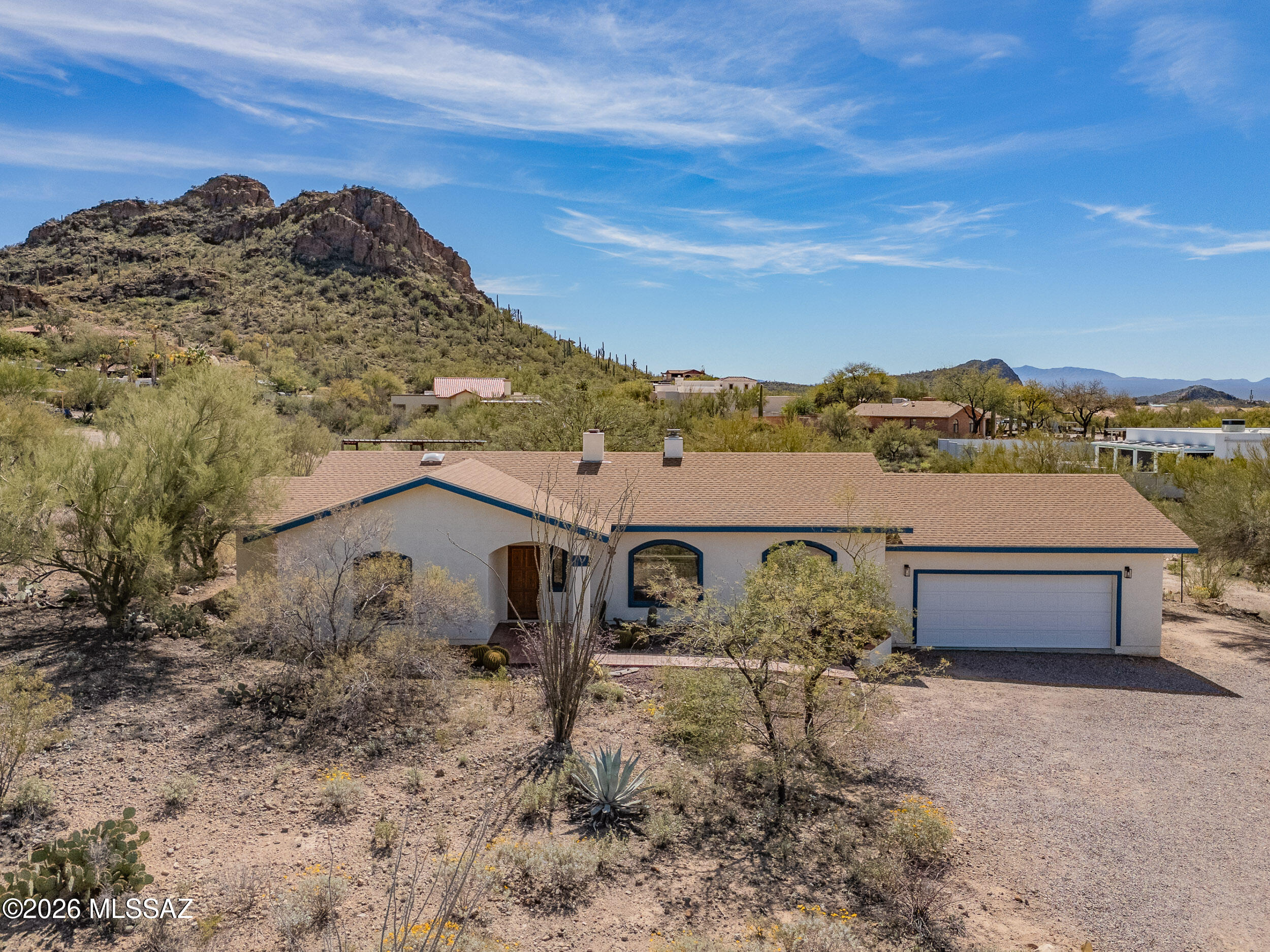 4155 West Coyote Ridge Trail Tucson, AZ 85746 - Photo 2 of 39 a view of a house with a yard and mountain view