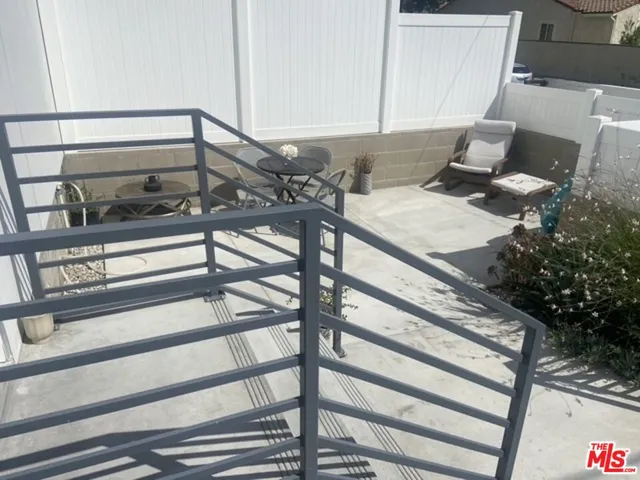 a view of a backyard with sitting area