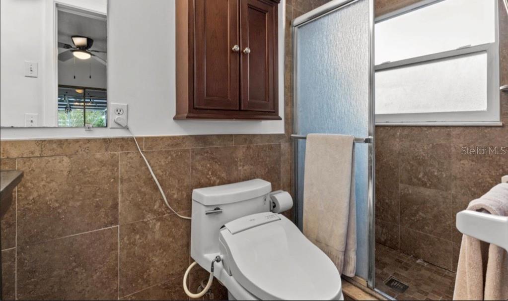 2516 Roberta Street Largo, FL 33771 - Photo 13 of 15 a bathroom with a toilet and a shower