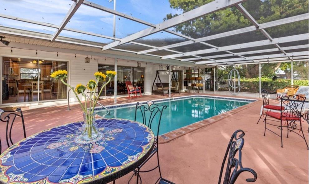 2516 Roberta Street Largo, FL 33771 - Photo 14 of 15 a view of a swimming pool with a patio