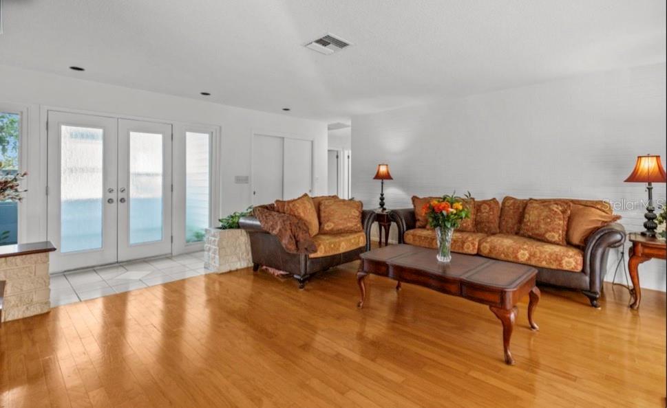 2516 Roberta Street Largo, FL 33771 - Photo 2 of 15 a living room with furniture and a wooden floor