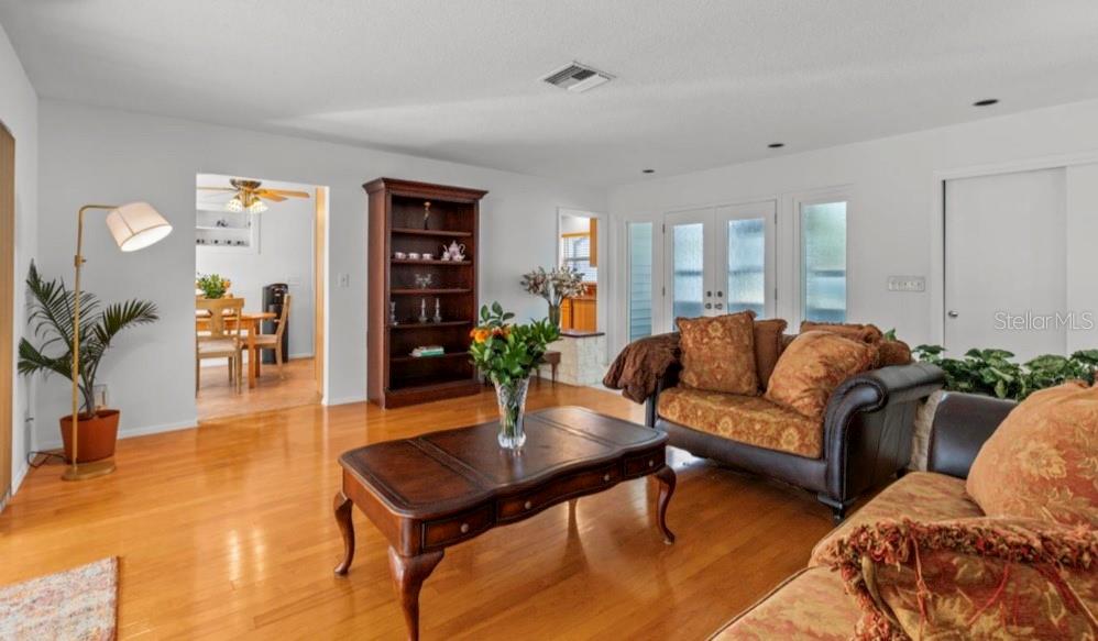 2516 Roberta Street Largo, FL 33771 - Photo 3 of 15 a living room with furniture and wooden floor