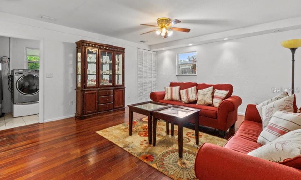 2516 Roberta Street Largo, FL 33771 - Photo 7 of 15 a living room with furniture and a wooden floor