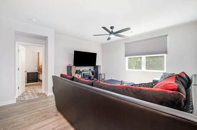 a living room with furniture and a rug