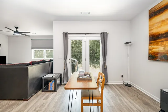 a view of kitchen with refrigerator dining table and chairs