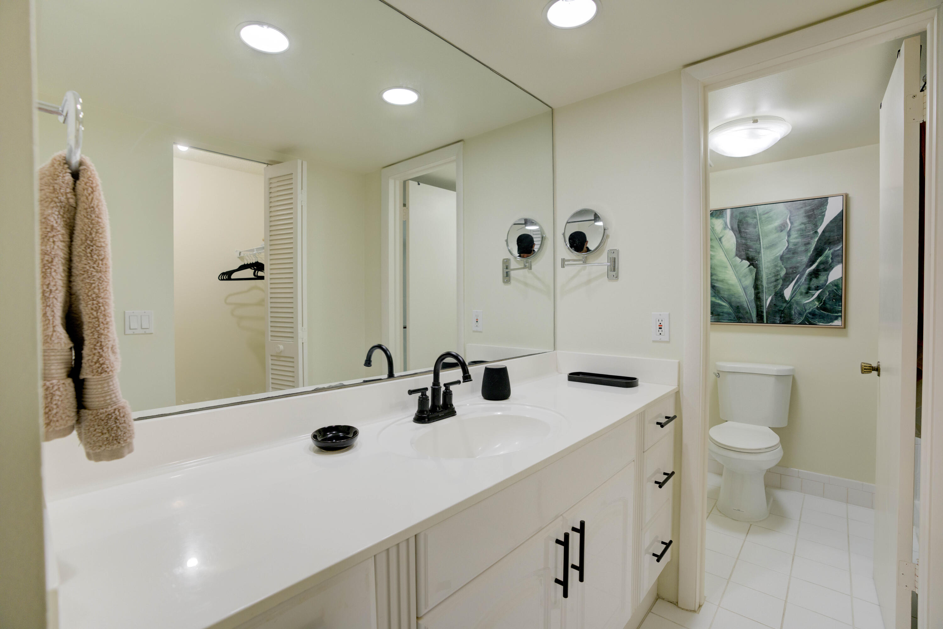 630 Ocean Drive, Unit 302 Juno Beach, FL 33408 - Photo 14 of 40 a bathroom with a sink a toilet and shower