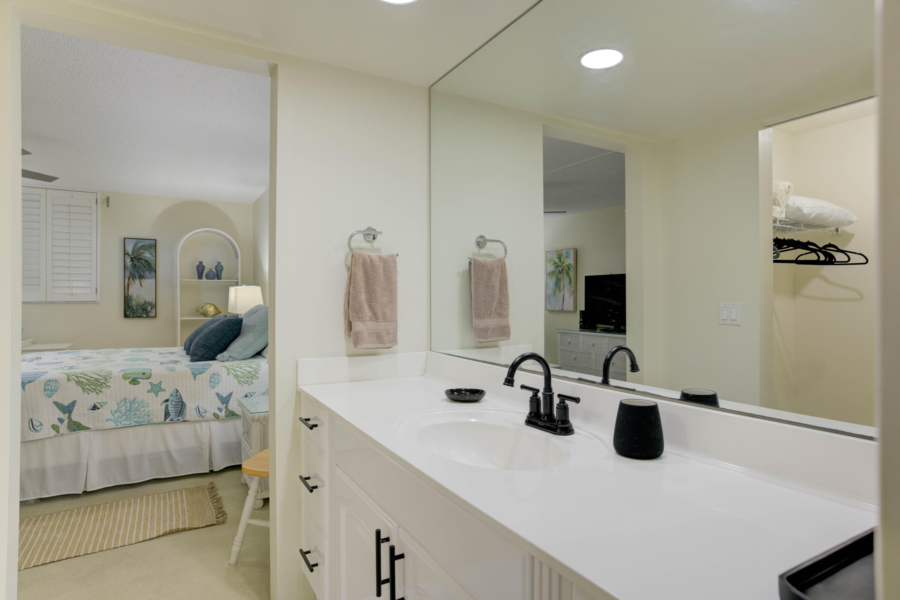 630 Ocean Drive, Unit 302 Juno Beach, FL 33408 - Photo 15 of 40 a bathroom with a double vanity sink