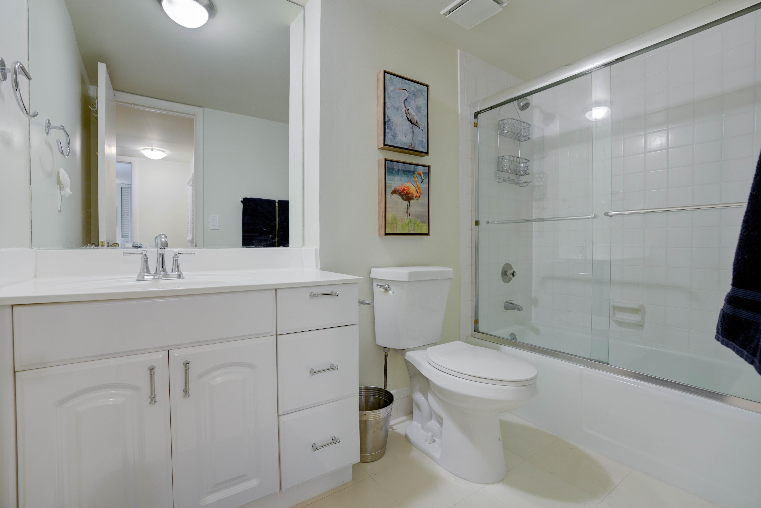 630 Ocean Drive, Unit 302 Juno Beach, FL 33408 - Photo 20 of 40 a bathroom with a sink a toilet and shower