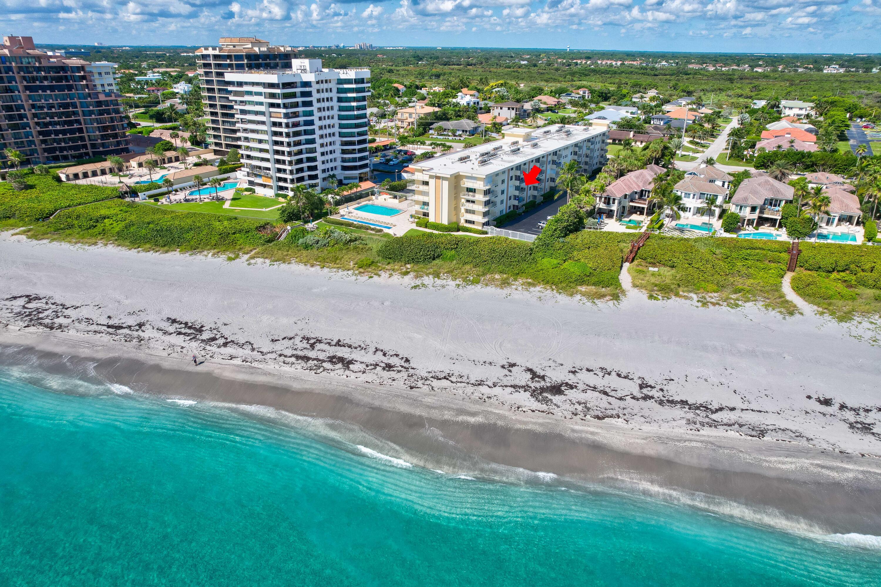 630 Ocean Drive, Unit 302 Juno Beach, FL 33408 - Photo 25 of 40 a view of a road with a building in the background