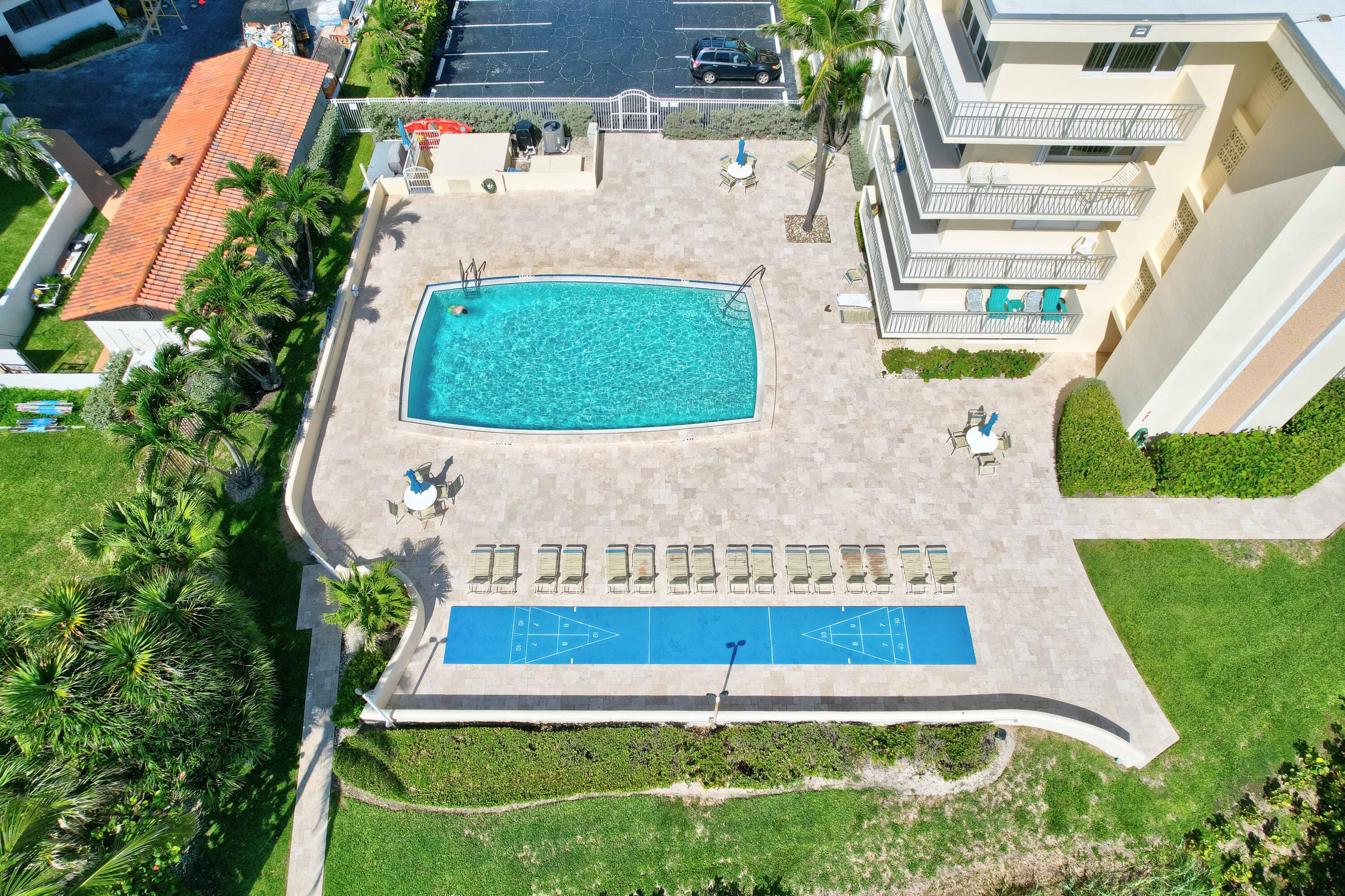 630 Ocean Drive, Unit 302 Juno Beach, FL 33408 - Photo 28 of 40 an aerial view of a house with a yard and a fountain