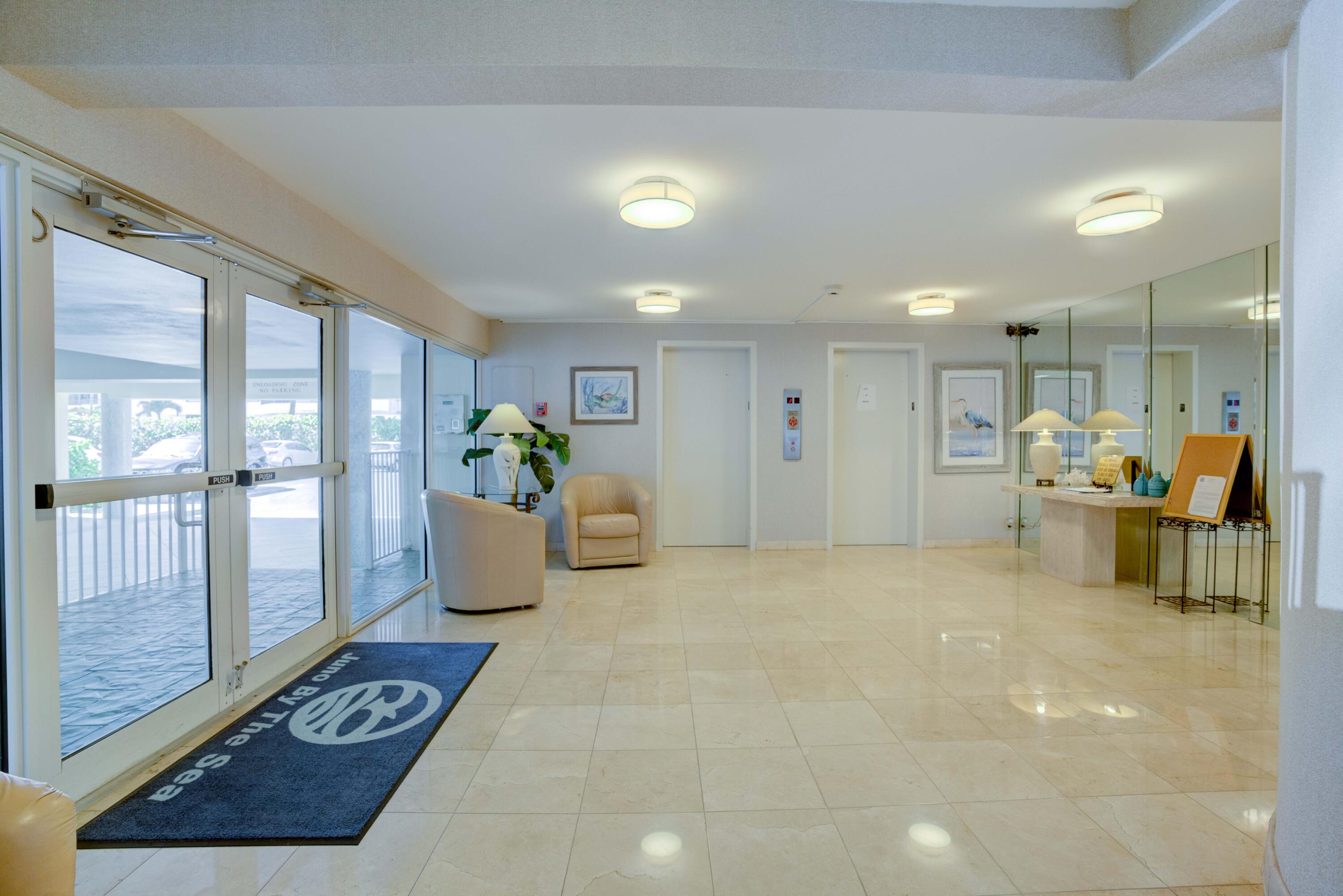 630 Ocean Drive, Unit 302 Juno Beach, FL 33408 - Photo 30 of 40 a living room with furniture and a potted plant
