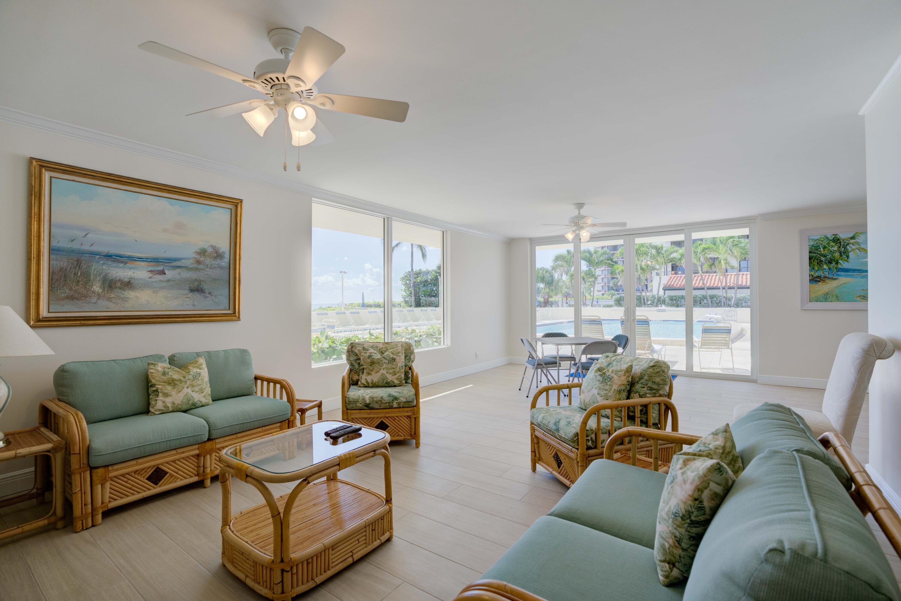 630 Ocean Drive, Unit 302 Juno Beach, FL 33408 - Photo 31 of 40 a living room with furniture and a large window