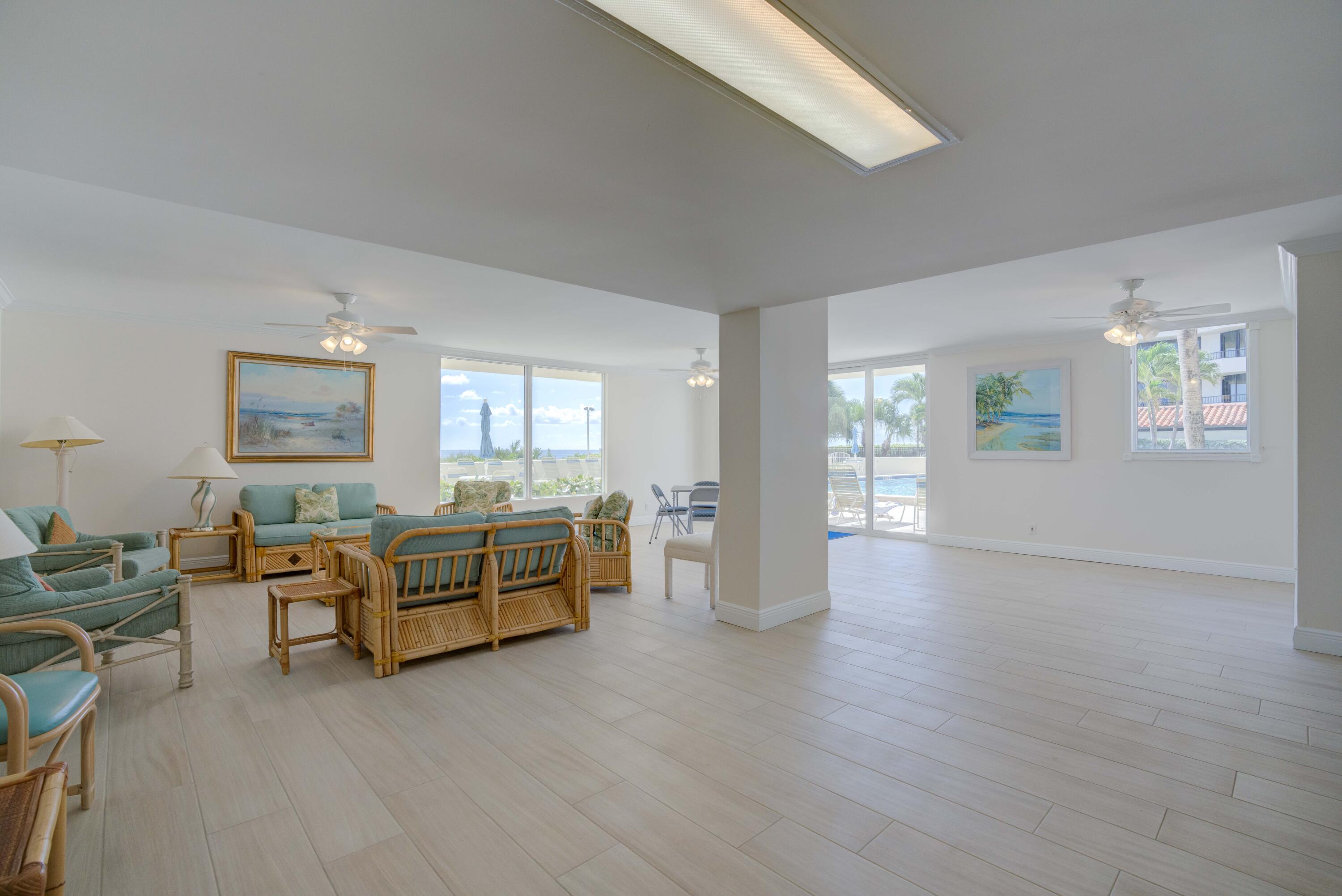 630 Ocean Drive, Unit 302 Juno Beach, FL 33408 - Photo 32 of 40 a living room with furniture and wooden floors