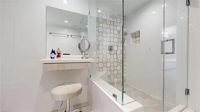 a bathroom with a sink toilet a shower and a mirror